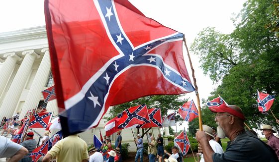 Supporters gather for a rally to protest the removal of Confederate flags from the Confederate Memorial Saturday, June 27, 2015, in Montgomery, Ala. (Julie Bennett/AL.com via AP) MAGS OUT; MANDATORY CREDIT